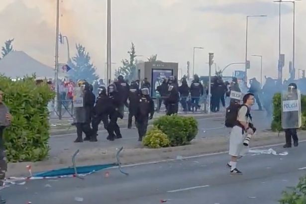 Arsenal fans caught up in trouble as police use TEAR GAS after clash with Atletico supporters