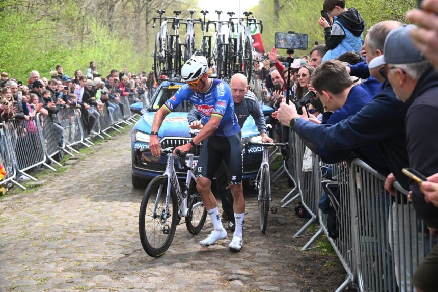 Mathieu van der Poel punctures twice on the Arenberg sector at Paris-Roubaix, teammate changes wheel
