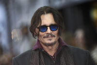 Johnny Depp Earns Huge CinemaCon Applause and Debuts Scrooge Transformation in ‘A Christmas Carol’ First Footage