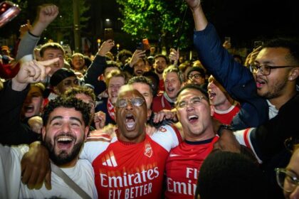 Ian Wright joins Arsenal fans at Emirates Stadium as thousands celebrate title win