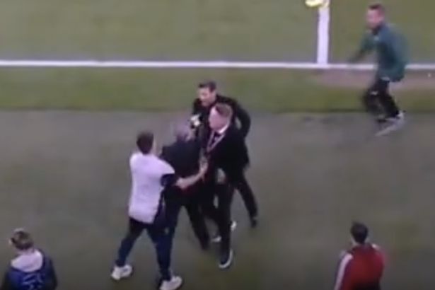 Diego Simeone pushes Arsenal chief Andrea Berta on touchline as UEFA official rushes in