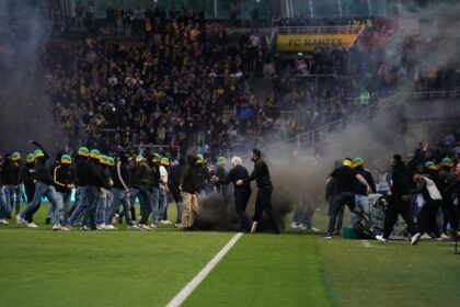Ligue 1 game abandoned after 22 minutes as ultras storm pitch and riot police deployed