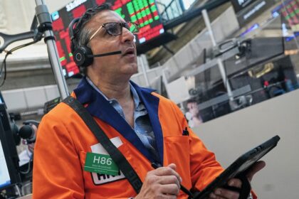 Dow gains 900 points as oil prices ease, while AI stocks keep Wall Street in check